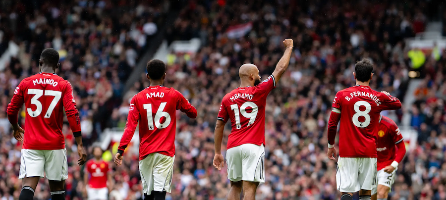 United players celebrate a goal against City